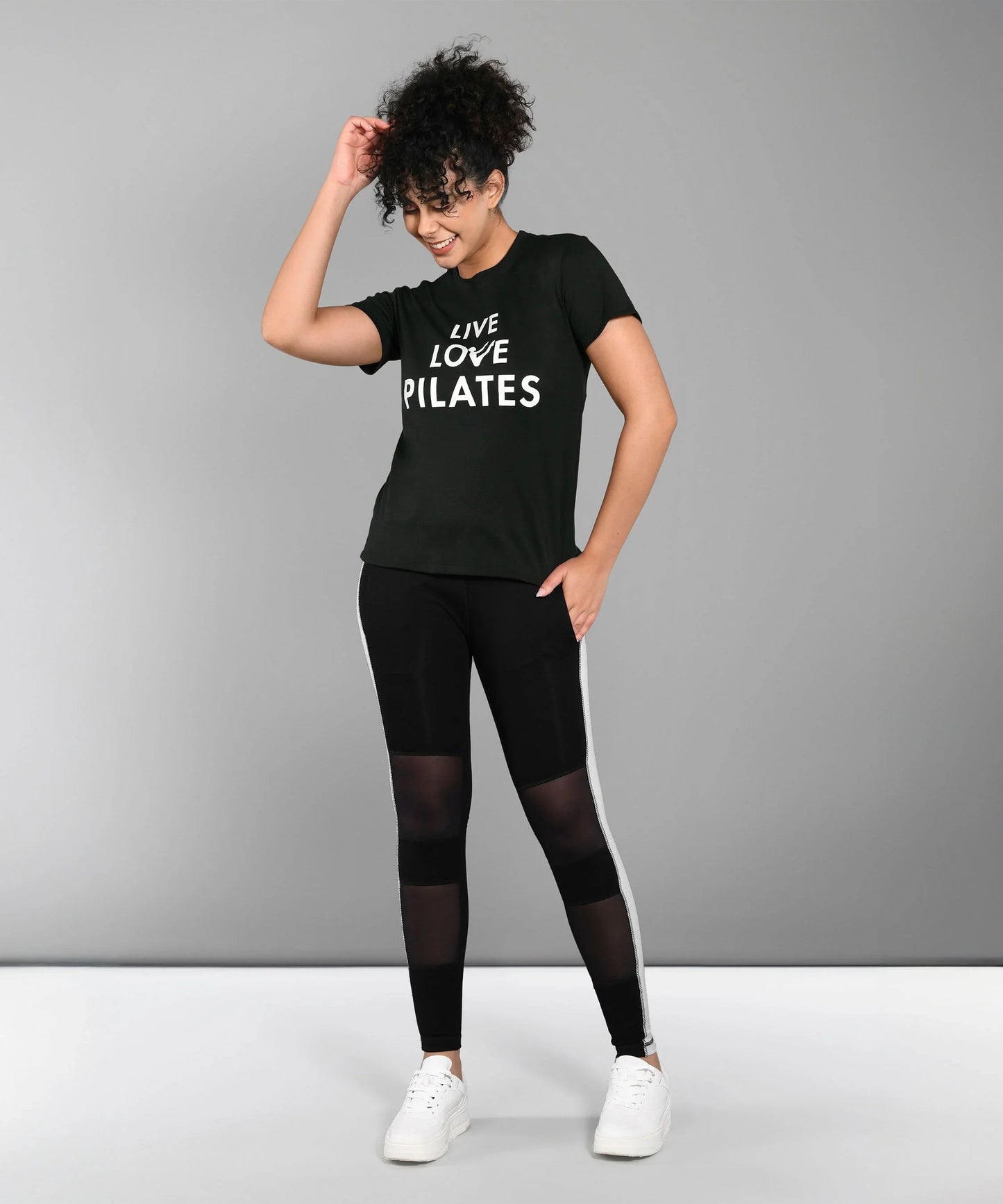 Black Pilates T Shirt for Women featuring Live Love Pilates text with stylish leggings