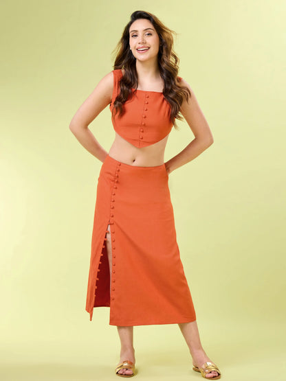 Close up of the square neckline and pointed hem on the sleeveless rust orange crop top.