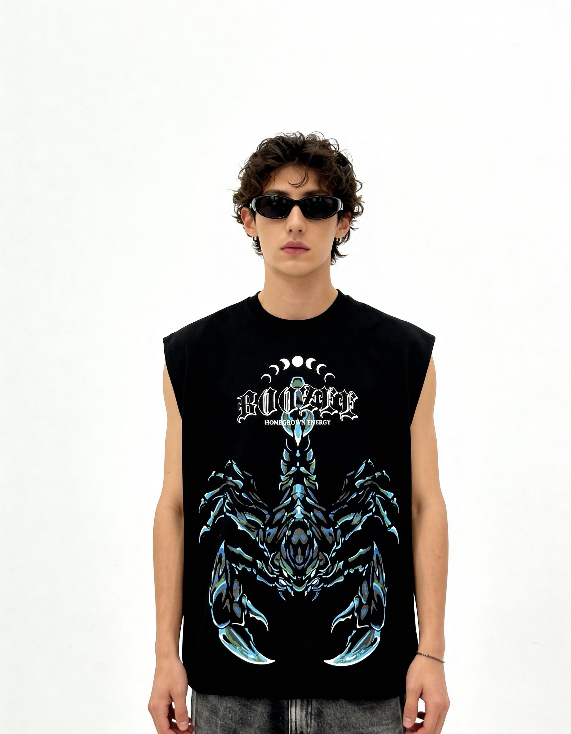 Person wearing a black sleeveless shirt with a graphic design on a white background