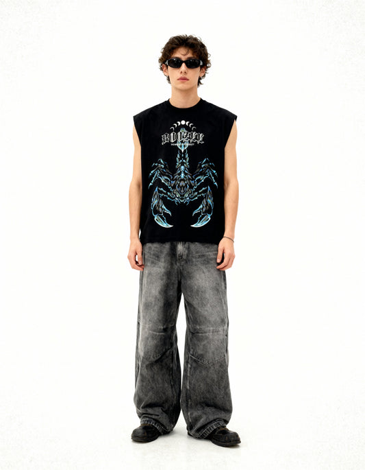Person wearing a black sleeveless shirt with a graphic design and gray pants on a white background