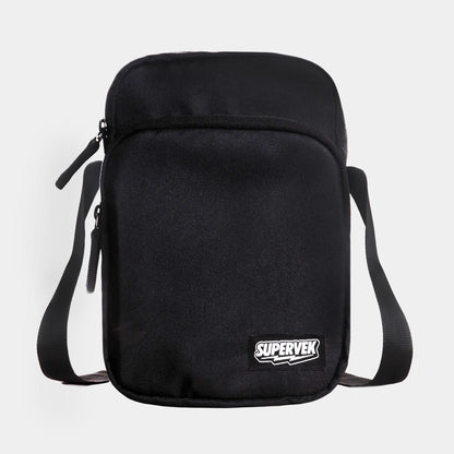 Supervek black "Sling" bag, front view showing minimalist design with dual zippers and logo patch and Classic Black #color_Classic Black