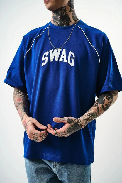 Person wearing a blue t-shirt with 'SWAG' printed on it against a white background