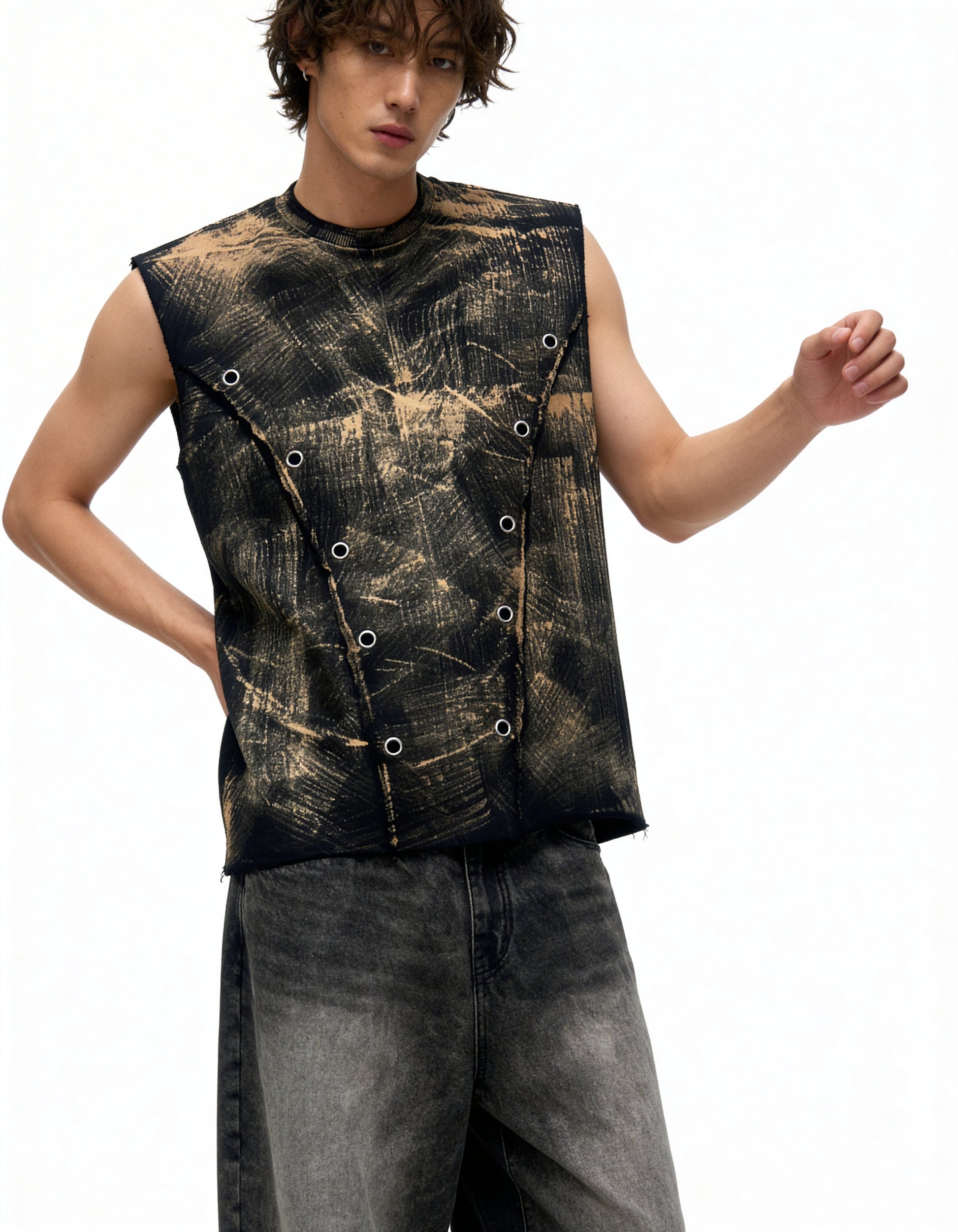 Person wearing a sleeveless, patterned top with a white background