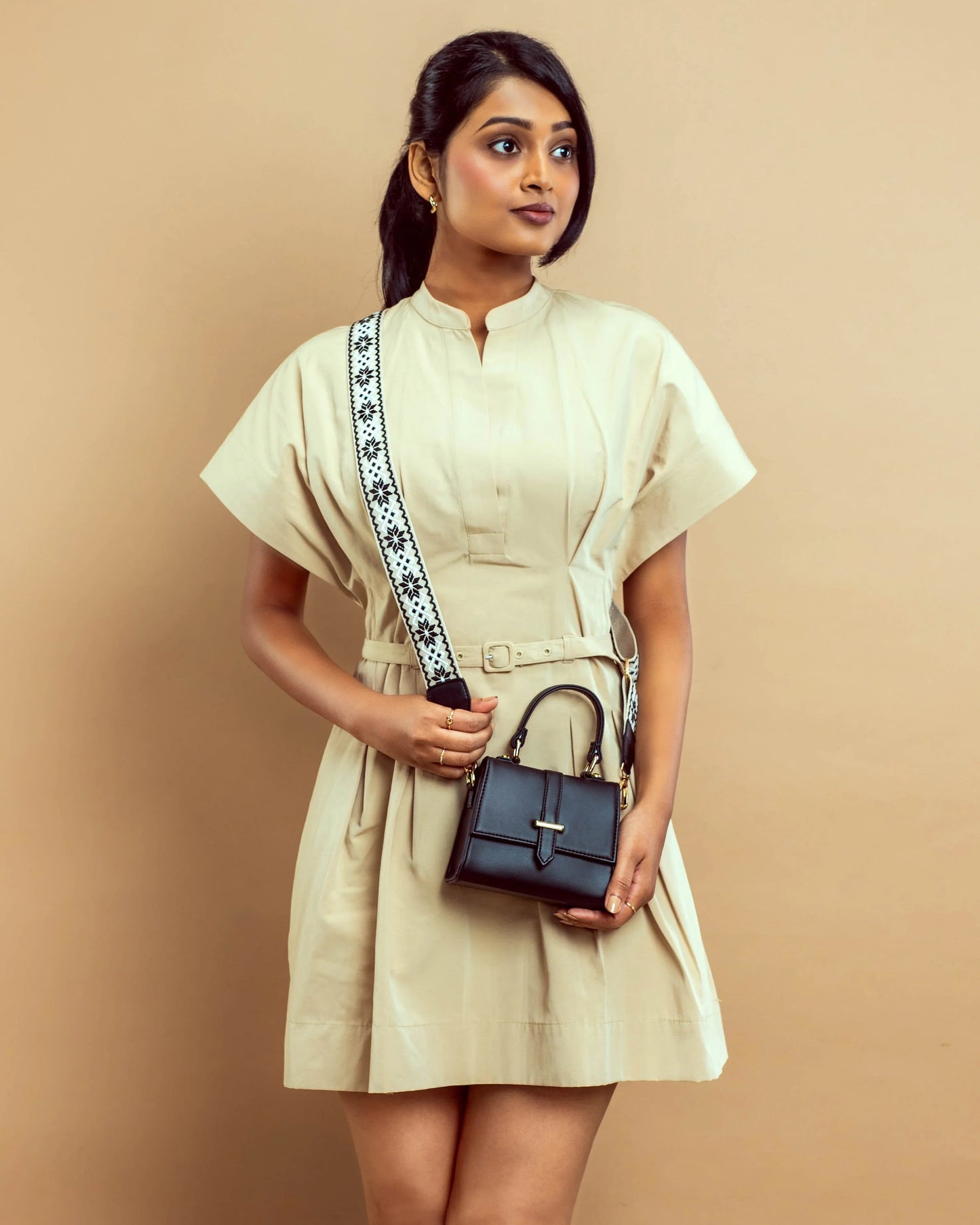 Stylish small shoulder bag for women by Stylera, paired perfectly with a chic beige dress