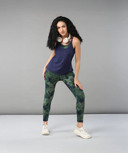 Model wearing a navy top and green tie dye bra t shirt for stylish activewear looks