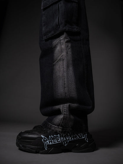 Model posing in wide leg tough jeans streetwear outfit with chunky boots.