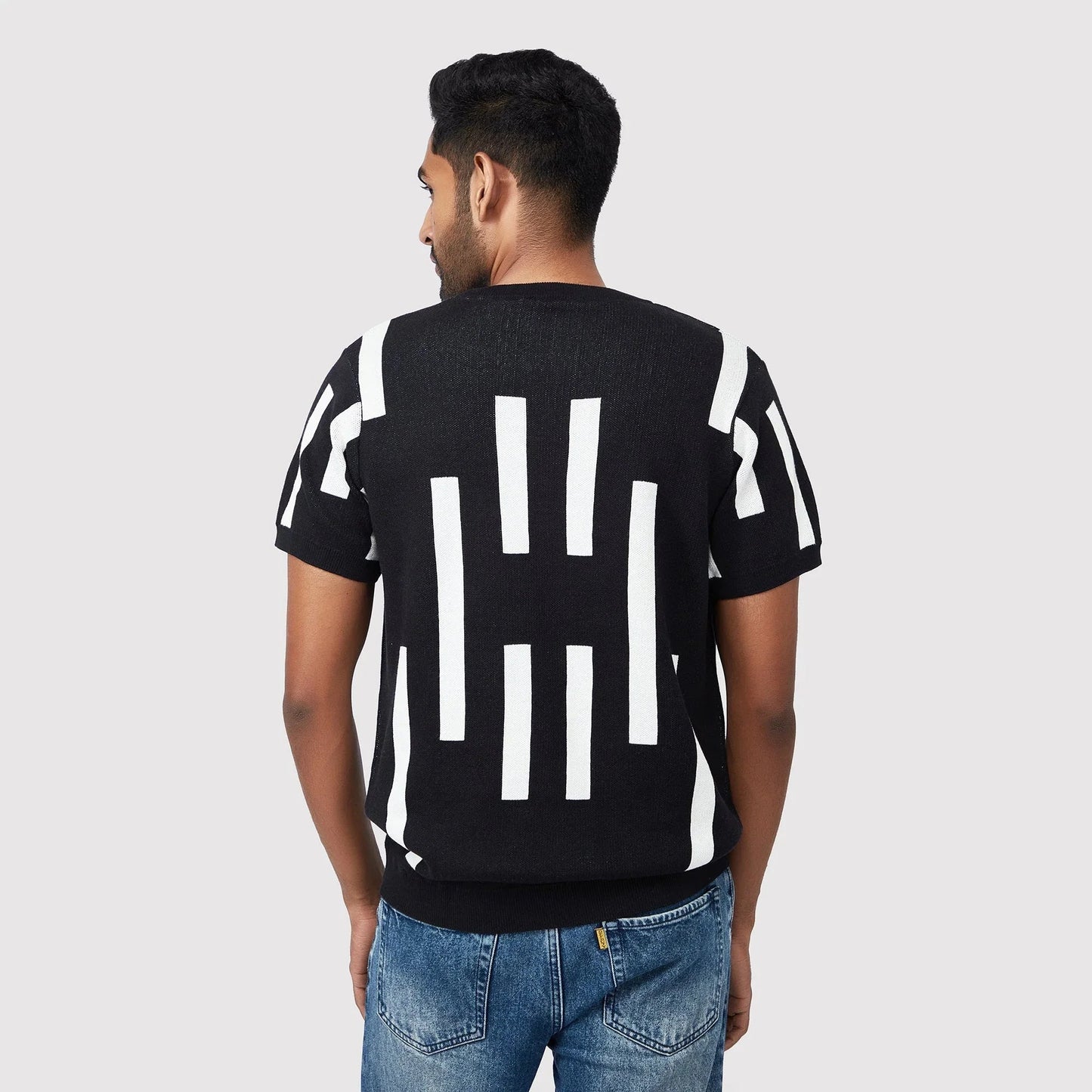 Trendy casual black tee with bold white geometric patterns on the back for a stylish look