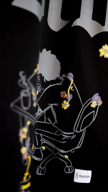 Stylstpls trendy streetwear black t-shirt featuring a graphic design with colorful floral accents